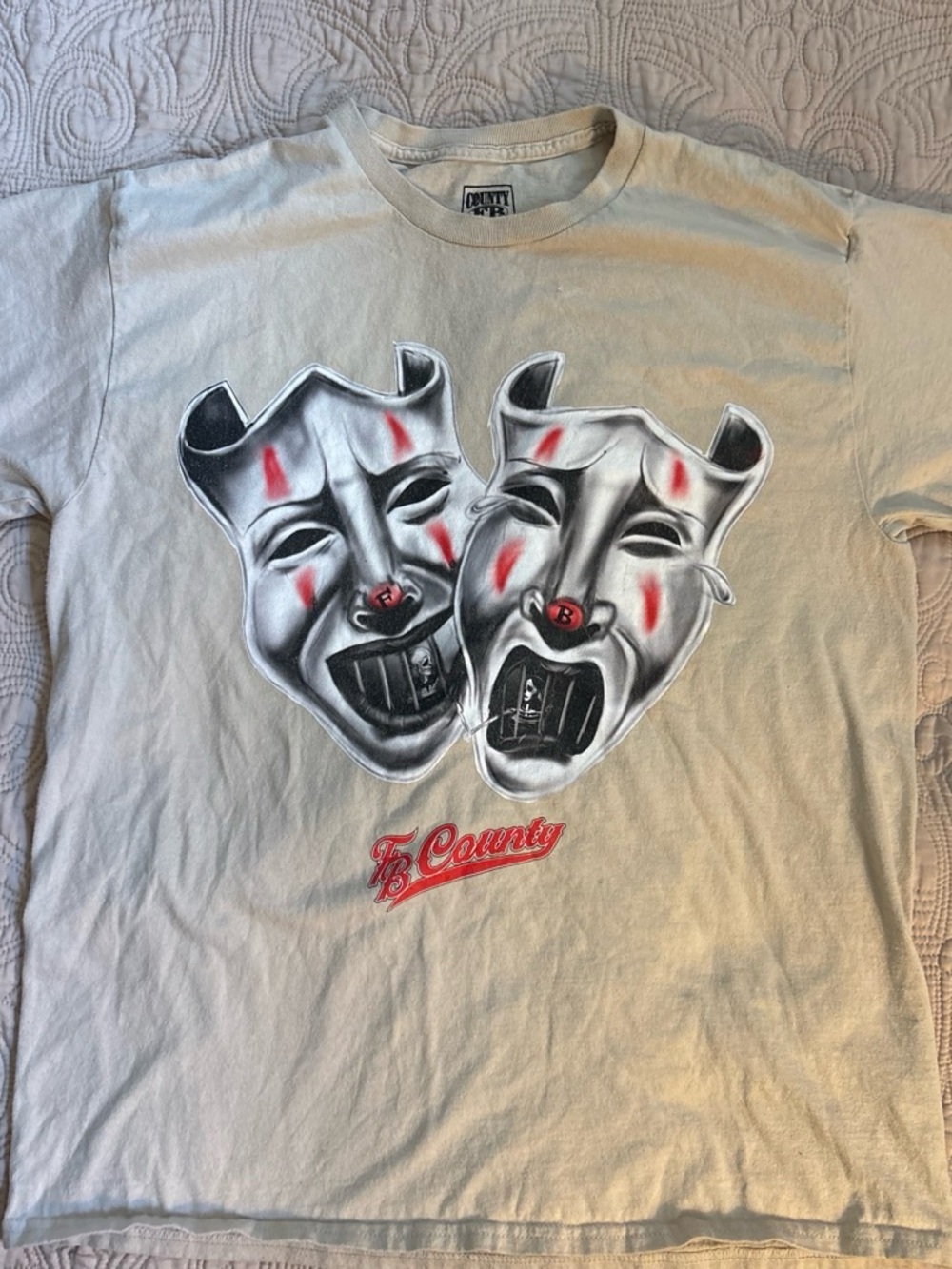 County Brand Men's Cream Short Sleeve Graphic Tee with Theatrical Mask Design